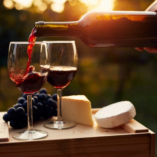 pouring-wine-cheese-sunset
